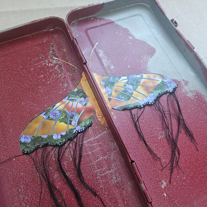 butterfly collage artwork made from recycled magazine pages