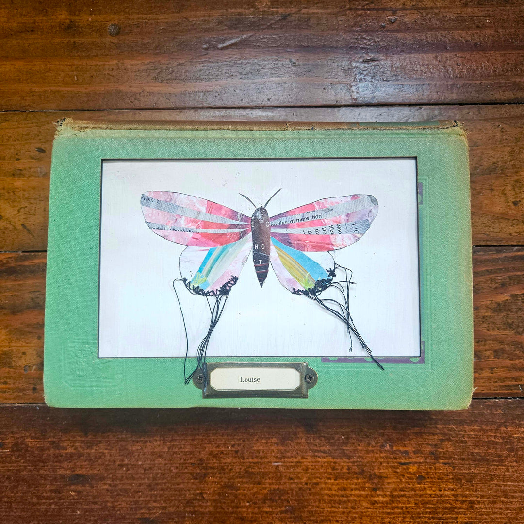 Handmade butterfly moth collage in a vintage book frame. Eco-friendly wall art made from recycled magazines. A unique gift for nature lovers.