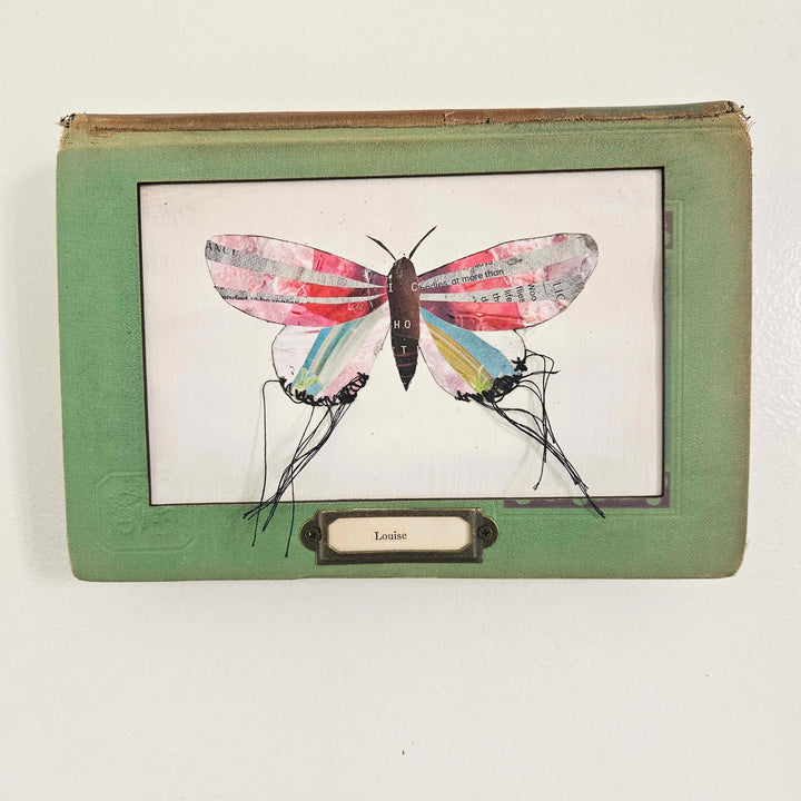 Handmade butterfly moth collage in a vintage book frame. Eco-friendly wall art made from recycled magazines. A unique gift for nature lovers.