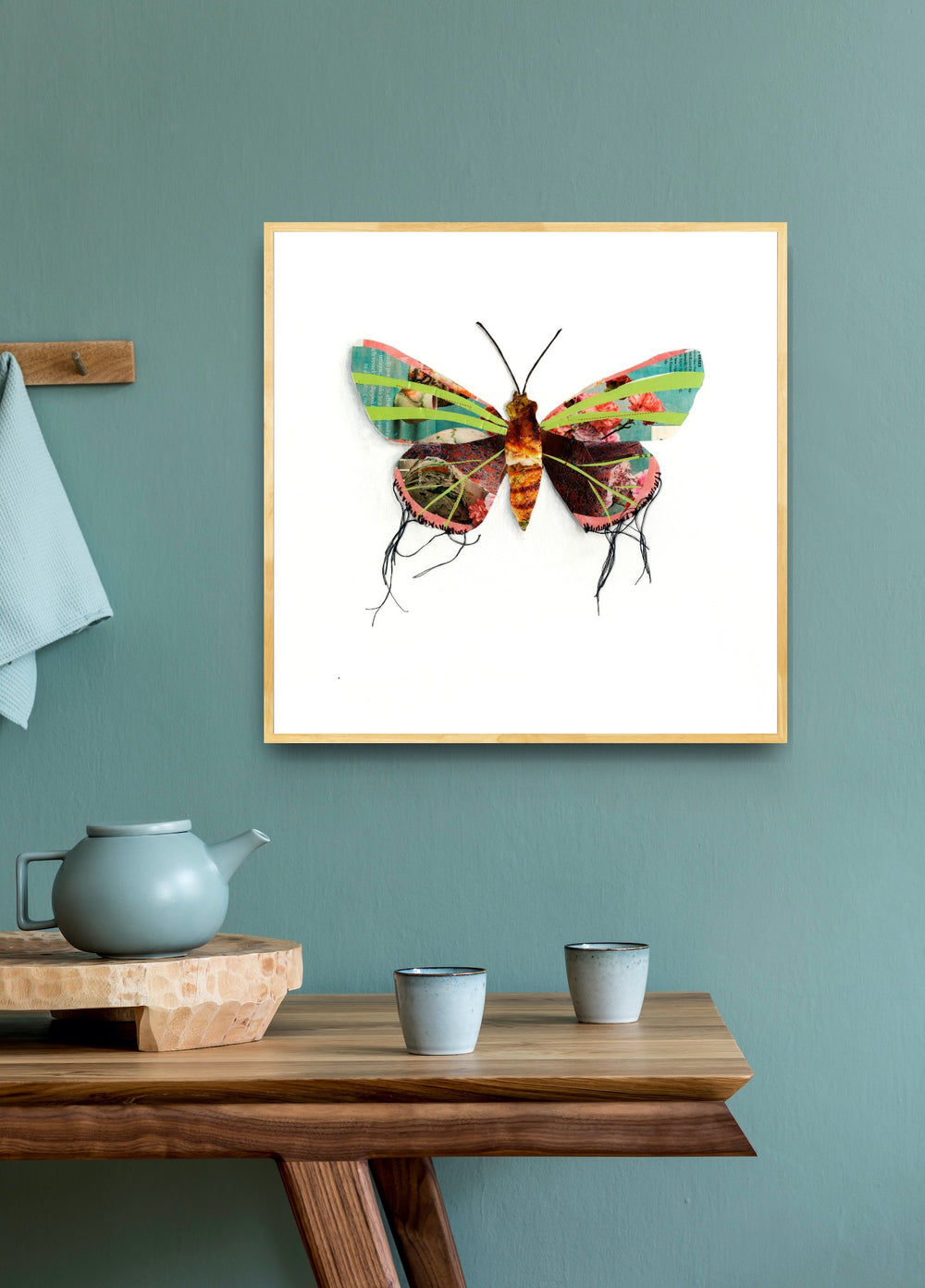 Seraphina is a butterfly / moth collage created with recycled magazine bits embellished with delicate hand stitching. Museum-quality wall art.