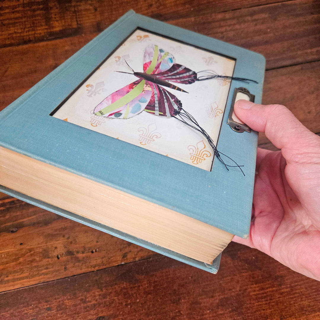 Lily is a handmade butterfly moth collage in a vintage book frame. Eco-friendly wall art made from recycled magazines. A unique gift for nature lovers.