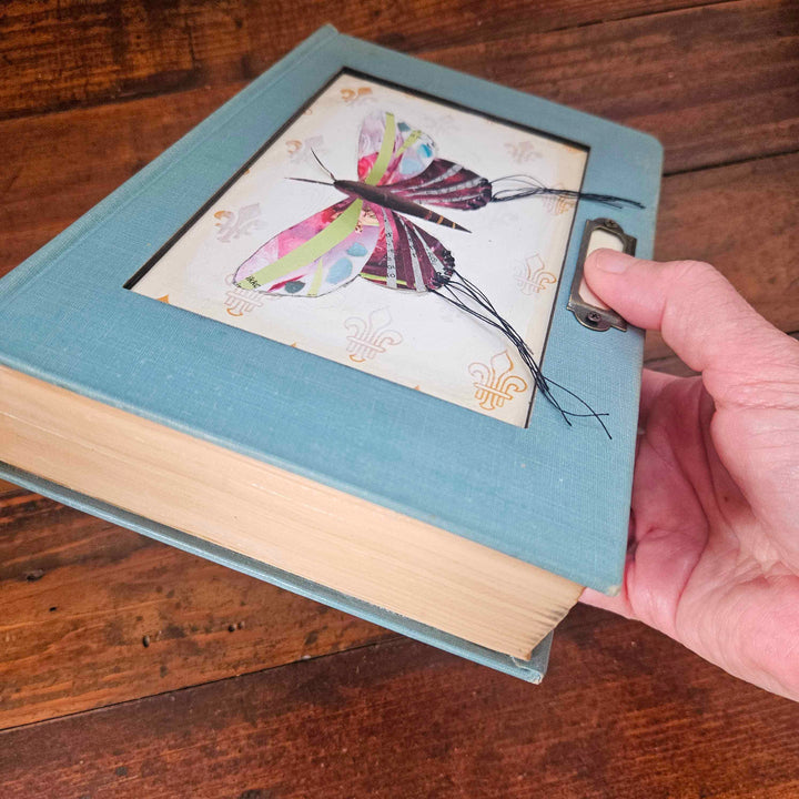 Lily is a handmade butterfly moth collage in a vintage book frame. Eco-friendly wall art made from recycled magazines. A unique gift for nature lovers.