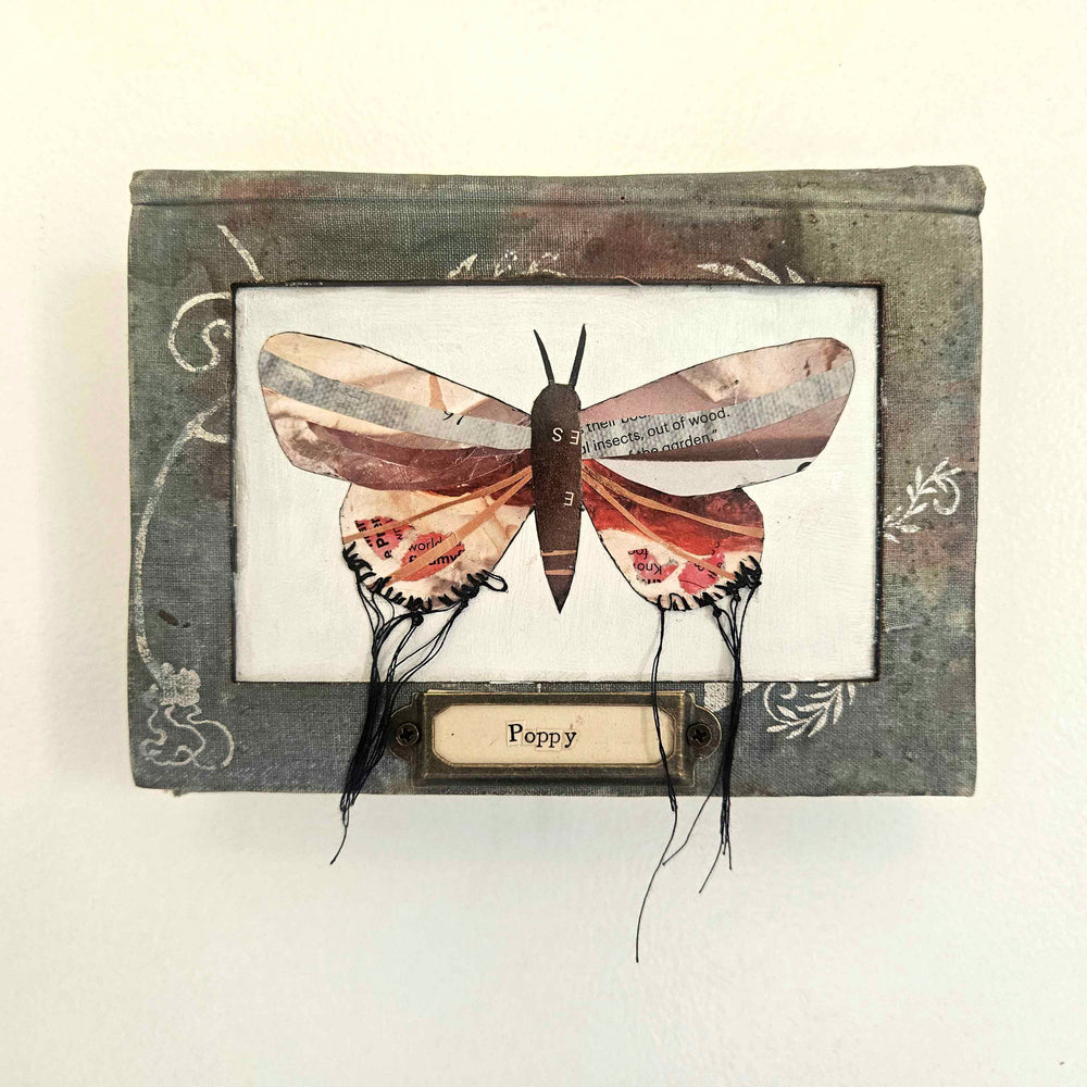 Handmade butterfly moth collage set into a vintage book as frame. Eco-friendly wall art made from recycled magazines and vintage books. A unique gift for book and nature lovers.